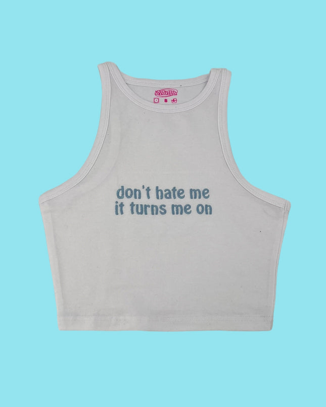 a white crop top that says, don&#39;t hate me if turns me on