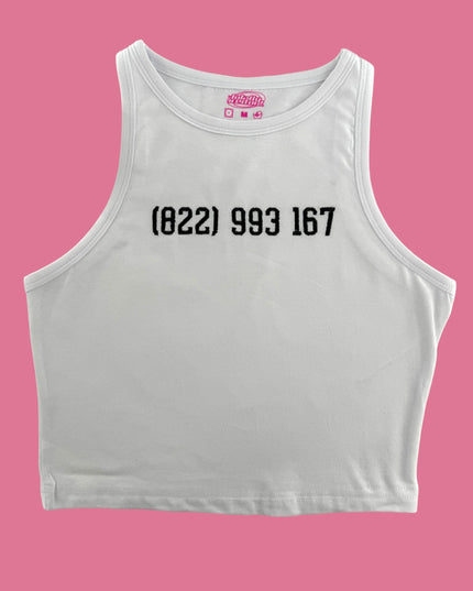 a white crop top with a pink background