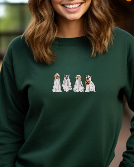 a woman wearing a green sweatshirt with three dogs on it