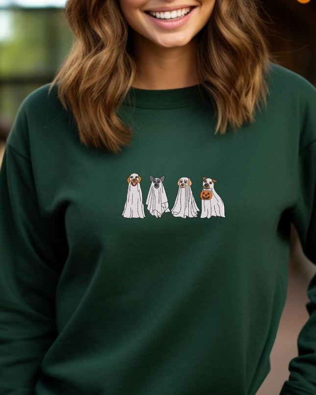 a woman wearing a green sweatshirt with three dogs on it