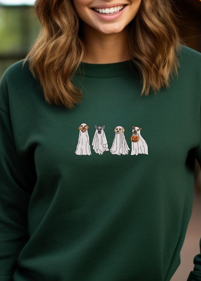 a woman wearing a green sweatshirt with three dogs on it