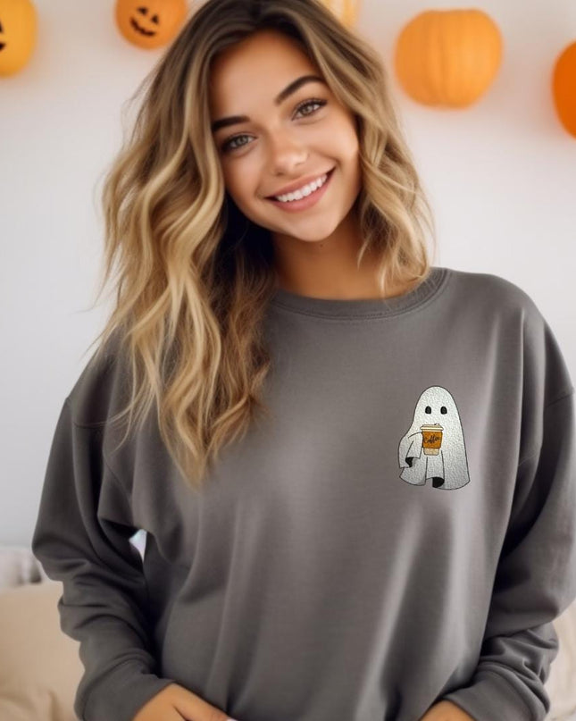 a woman standing in front of a wall with pumpkins
