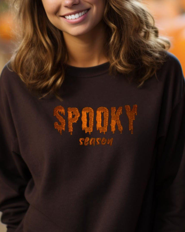 a woman wearing a spooky brown shirt