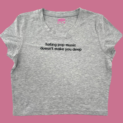 a women&#39;s crop top that says hating pop music doesn&#39;t make you