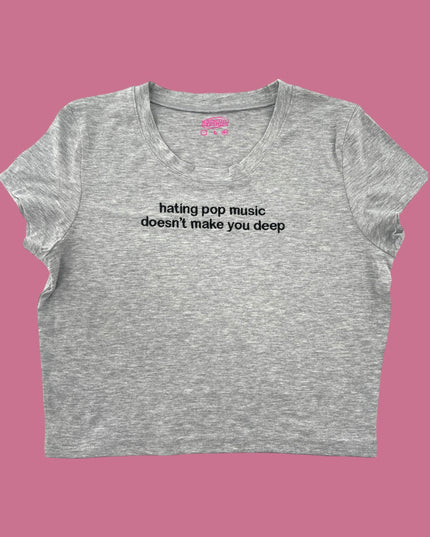 a women&#39;s crop top that says hating pop music doesn&#39;t make you