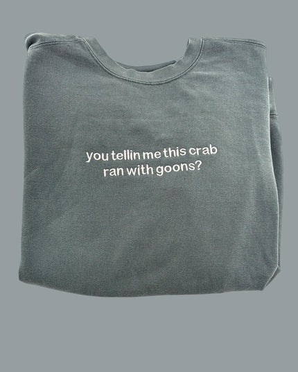 a gray t - shirt with white writing that says, you tell me this crab