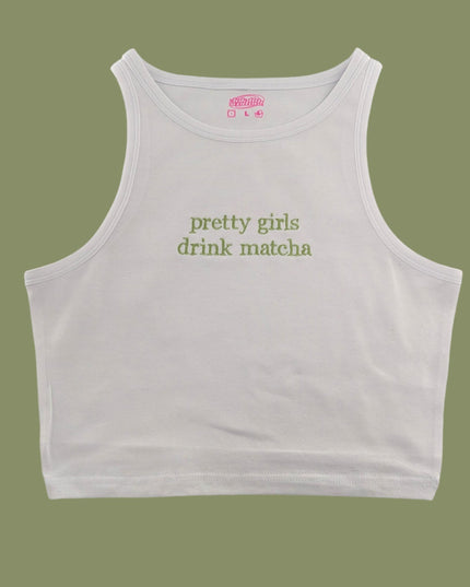a white crop top that says pretty girls drink matcha