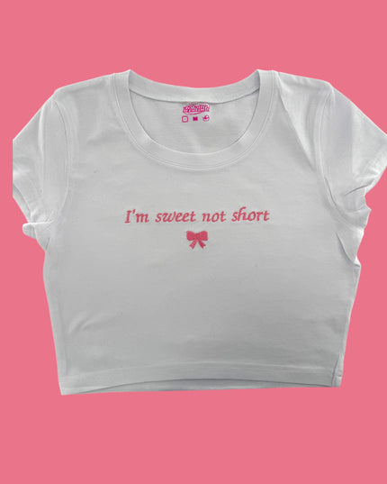 a white crop top that says i&#39;m sweet not short