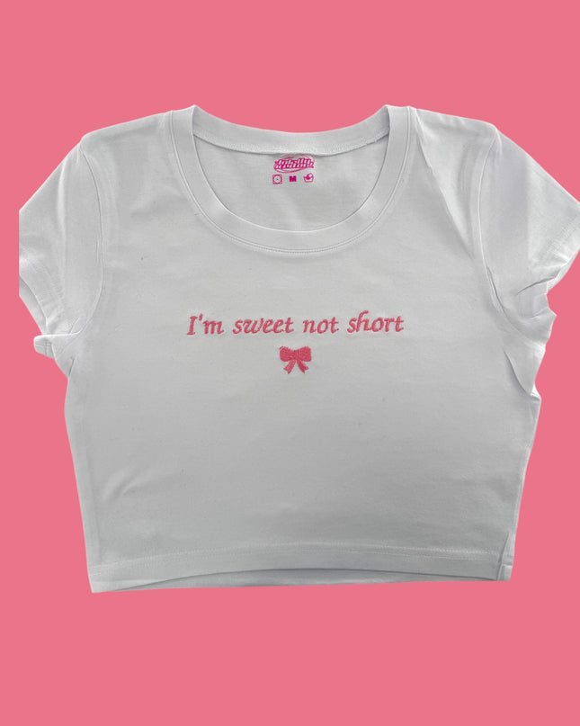 a white crop top that says i&#39;m sweet not short