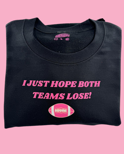 a black t - shirt with a pink football on it