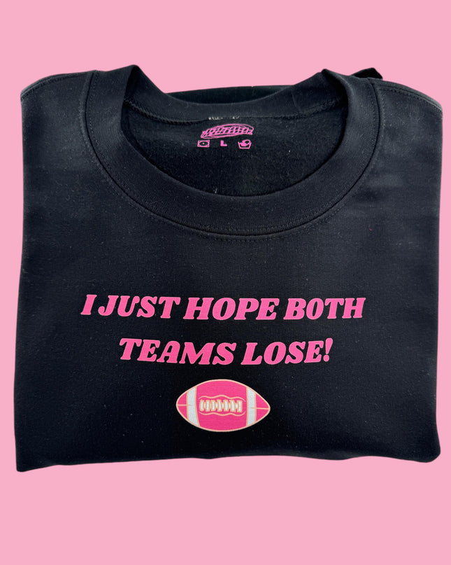 a black t - shirt with a pink football on it