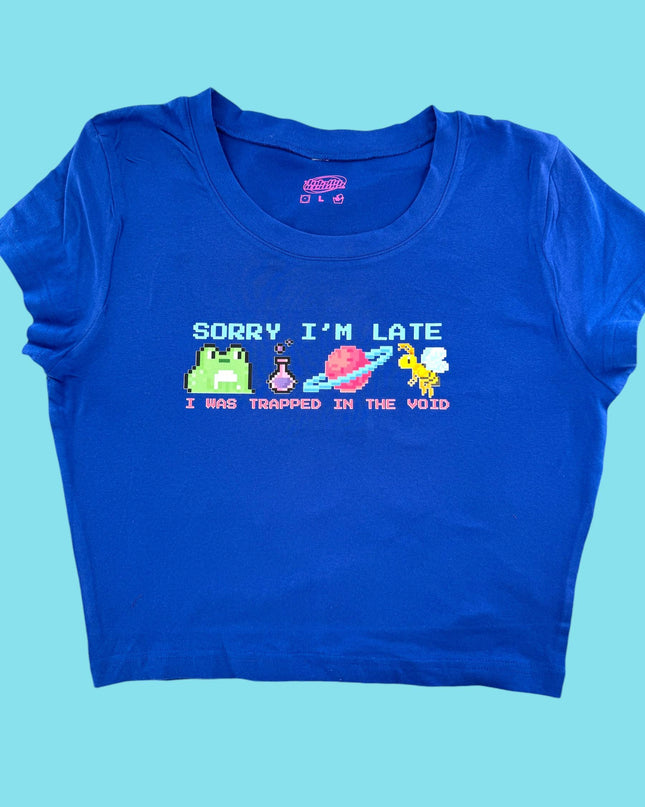 a blue t - shirt that says sorry i&#39;m late and trapped in the