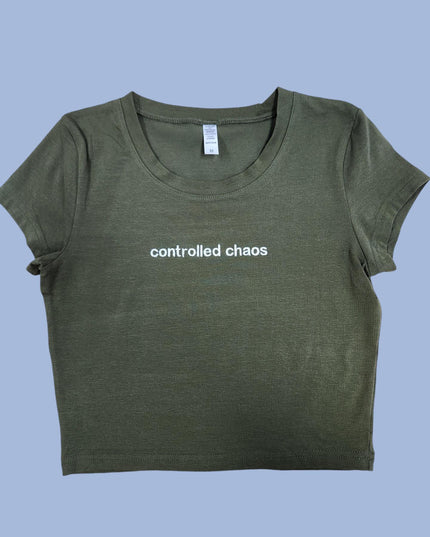 a green t - shirt with the words controlled chaos printed on it