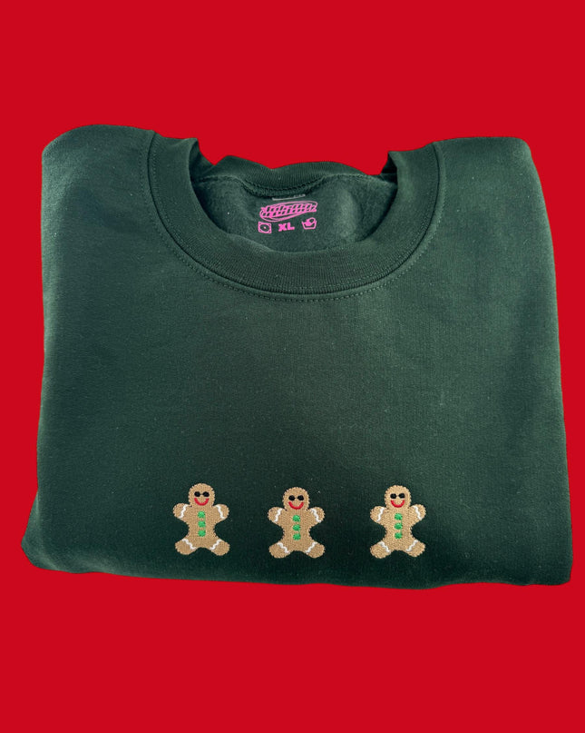 a green t - shirt with three gingers on it