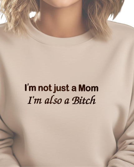 a woman wearing a sweatshirt that says i&#39;m not just a mom i &#39;