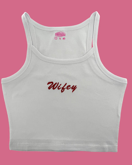 a white crop top with a pink background