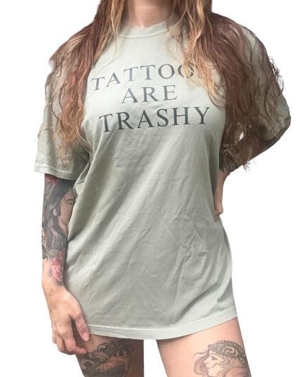 a woman with long hair wearing a tattoo t - shirt