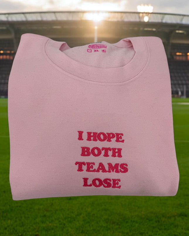 a pink t - shirt that says i hope both teams lose