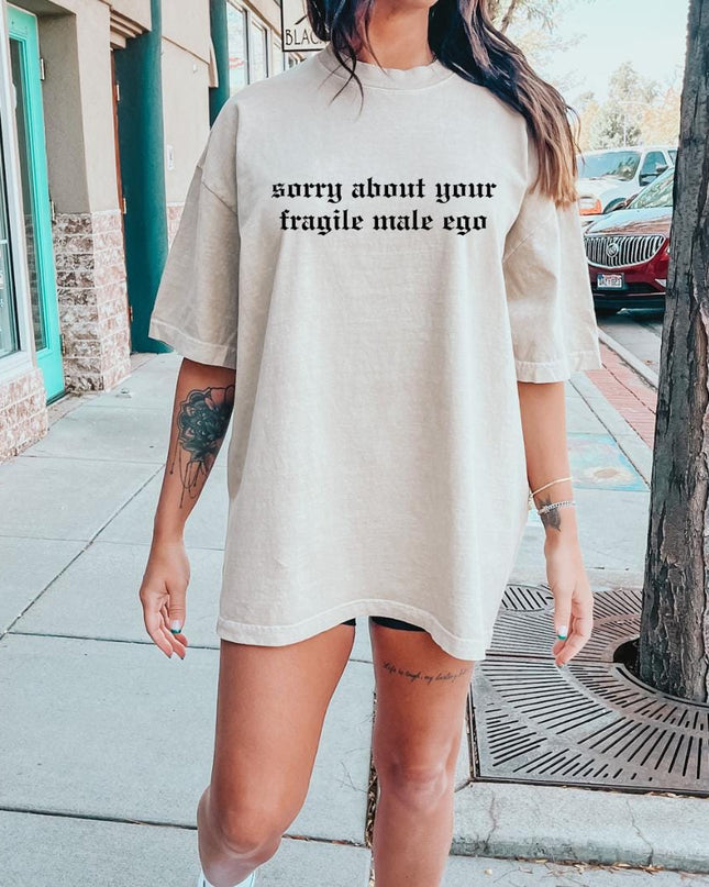 a woman standing on a sidewalk wearing a t - shirt