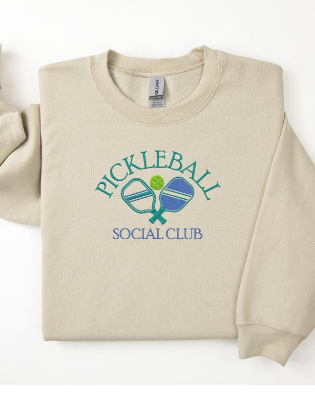 a white sweatshirt with a blue and green logo