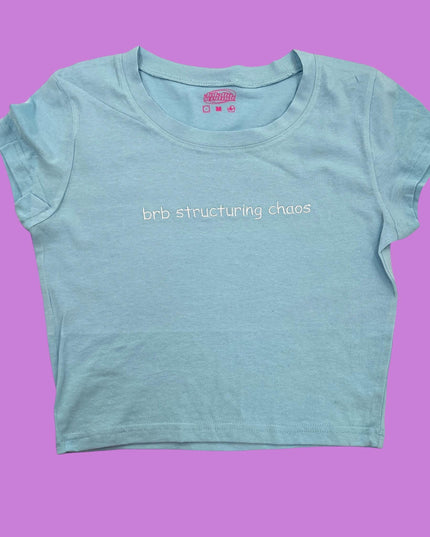 a t - shirt with the words bridling chaos printed on it