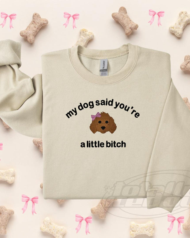 a white shirt with a brown dog on it