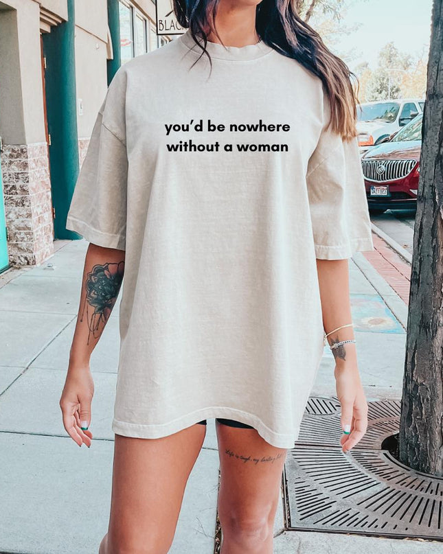 a woman standing on a sidewalk wearing a t - shirt that says you'd