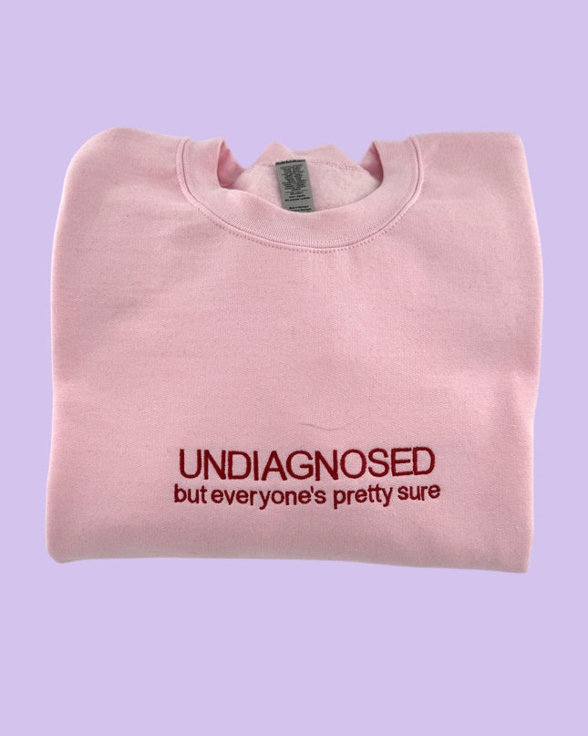 a pink t - shirt with the words undiagnosed but everyone's