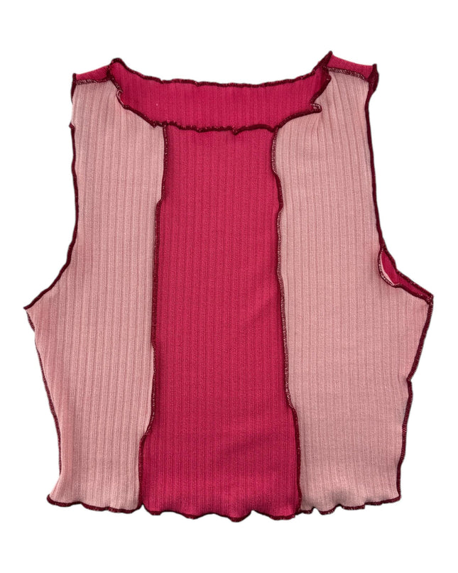 a pink and pink top with pleated sides