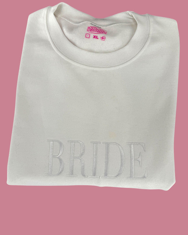 a white t - shirt with the word bride printed on it