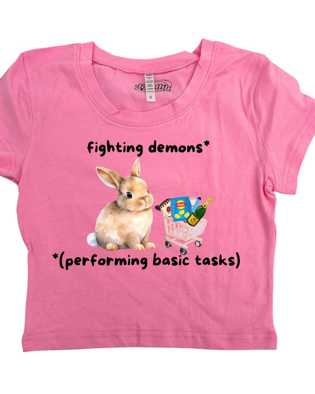 a pink shirt with a picture of a bunny and a butterfly