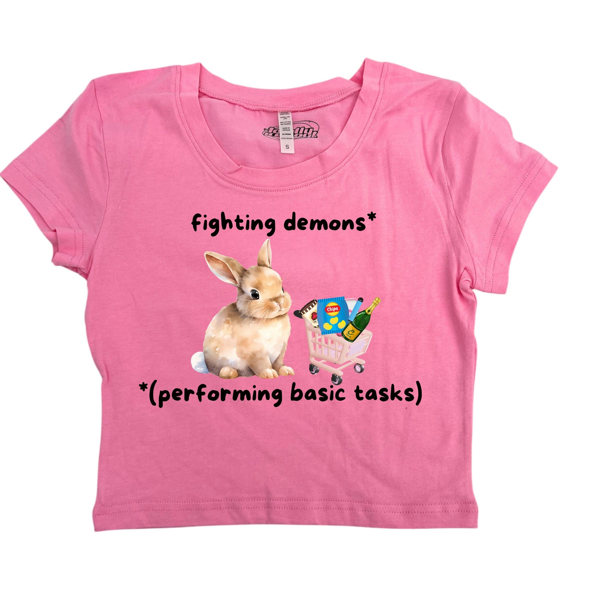 a pink shirt with a picture of a bunny and a butterfly