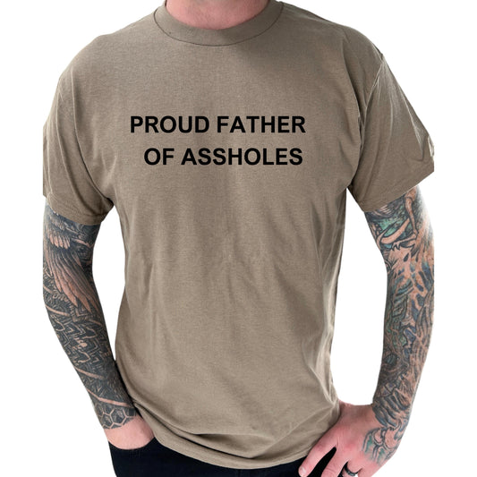 a man with a tattooed arm wearing a t - shirt that says proud father of