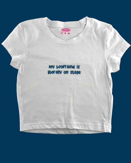 a white t - shirt with the words, my boyfriend is better than on stage