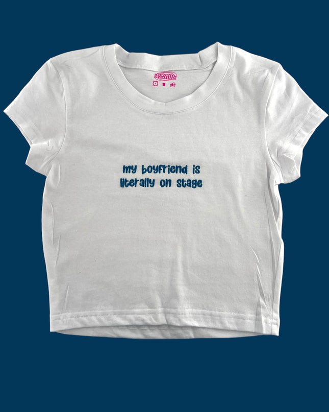 a white t - shirt with the words, my boyfriend is better than on stage