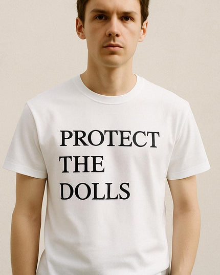 a man wearing a white t - shirt that says protect the dolls