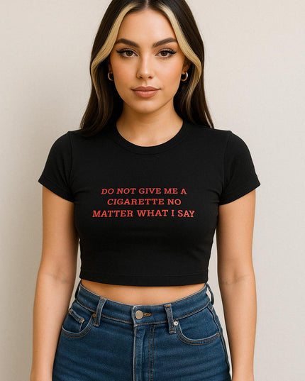 a woman wearing a black shirt that says do not give me a cigarette no matter