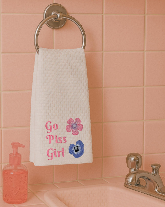a towel hanging on a towel rack in a bathroom