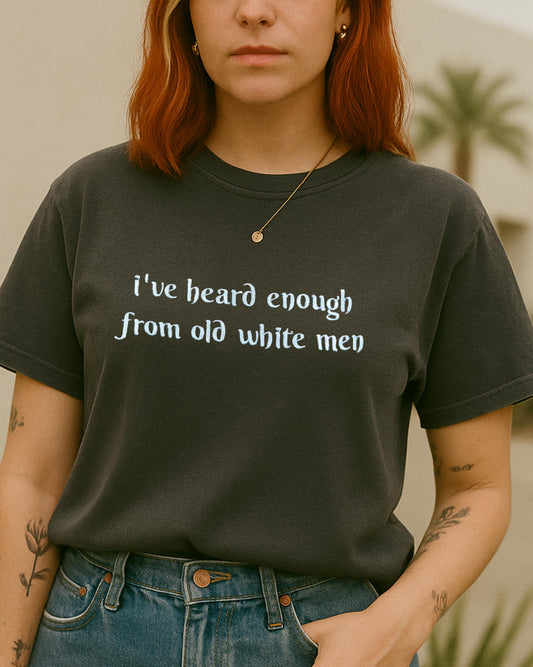 a woman with red hair wearing a t - shirt that says i've heard