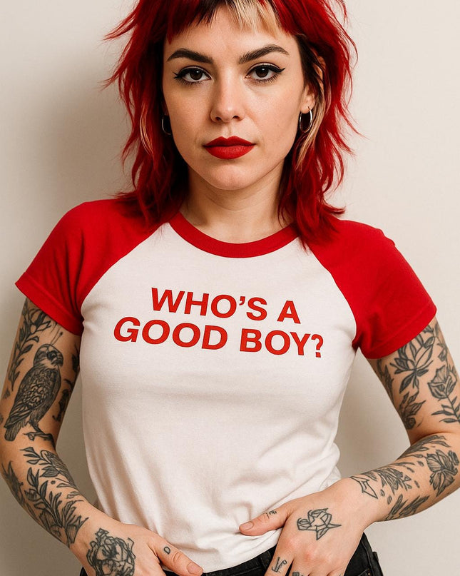 a woman with red hair wearing a red and white shirt
