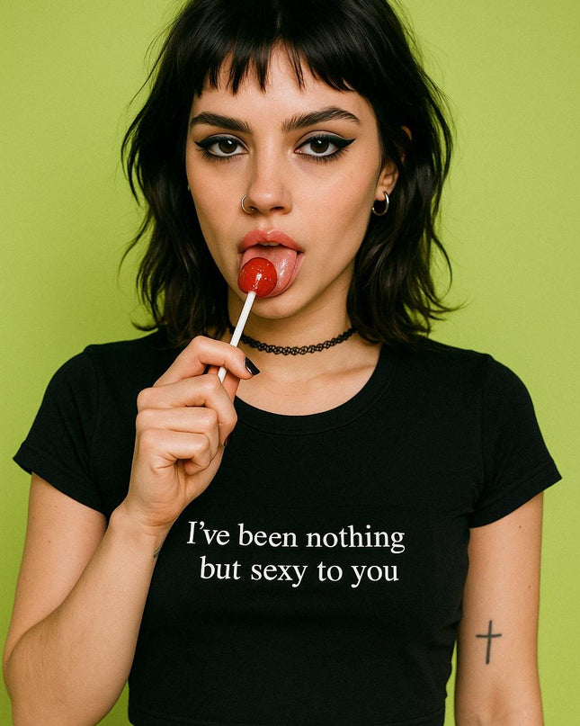 a woman holding a lollipop in her mouth