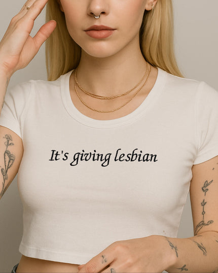 a woman wearing a white shirt has a tattoo on her arm