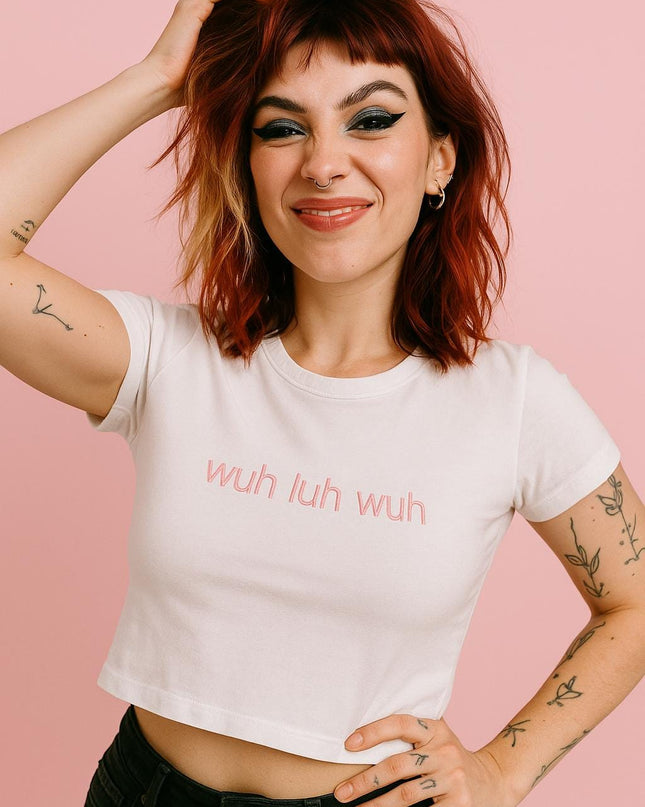 a woman with red hair wearing a white shirt