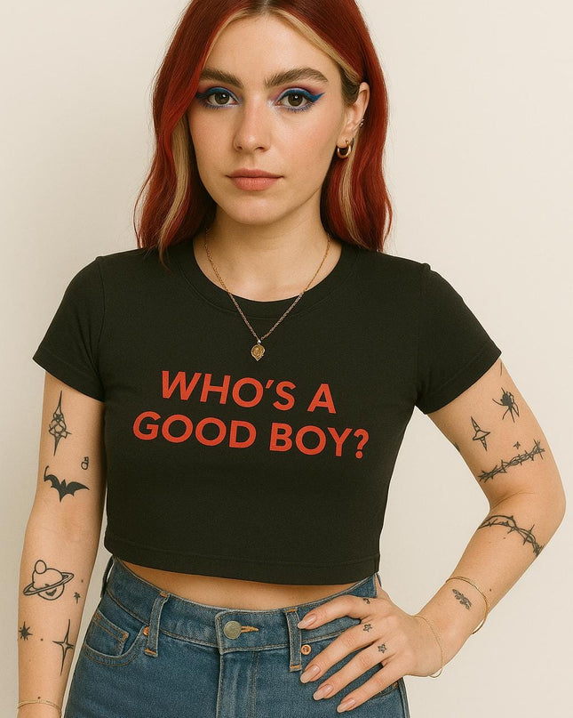 a woman with red hair wearing a black shirt with the words who's a