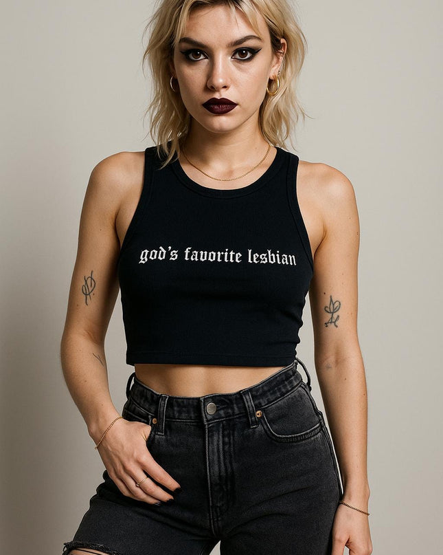 a woman wearing a black crop top and ripped jeans