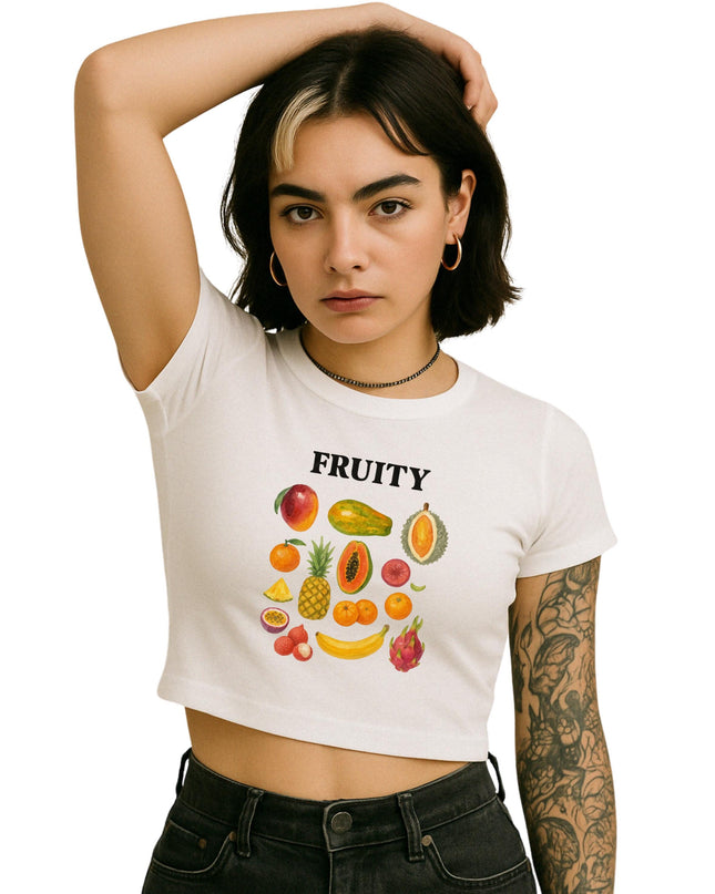 a woman wearing a white crop top with fruit on it