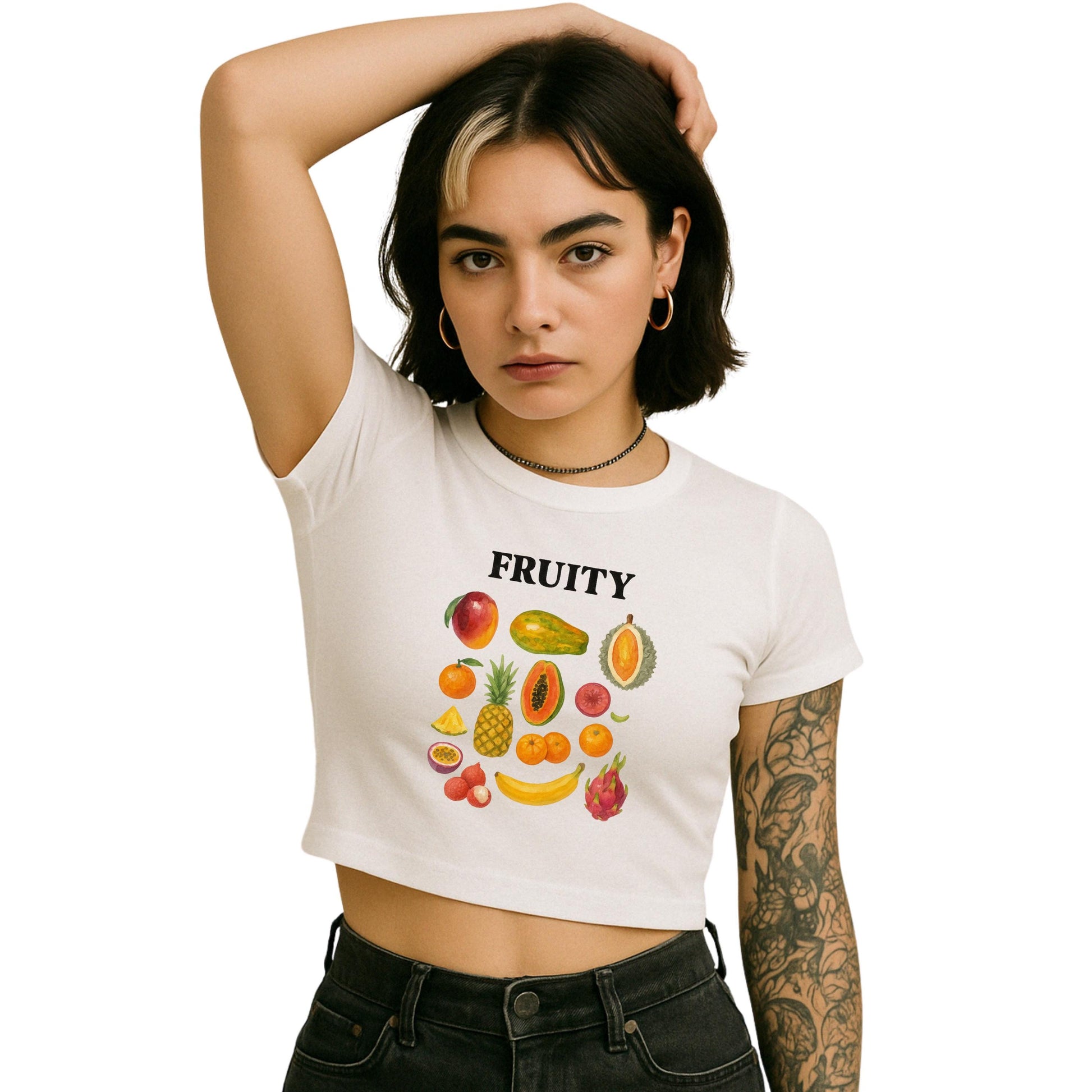 a woman wearing a white crop top with fruit on it