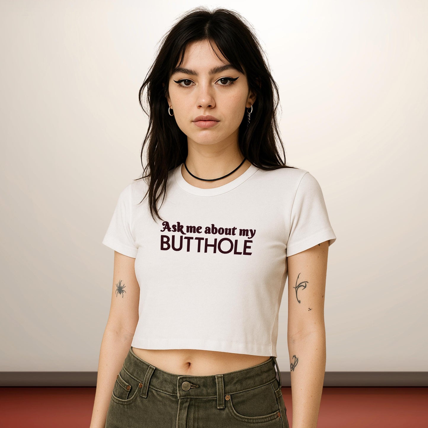 a woman wearing a t - shirt that says ask me about my butthole