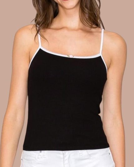 a woman wearing a black and white tank top