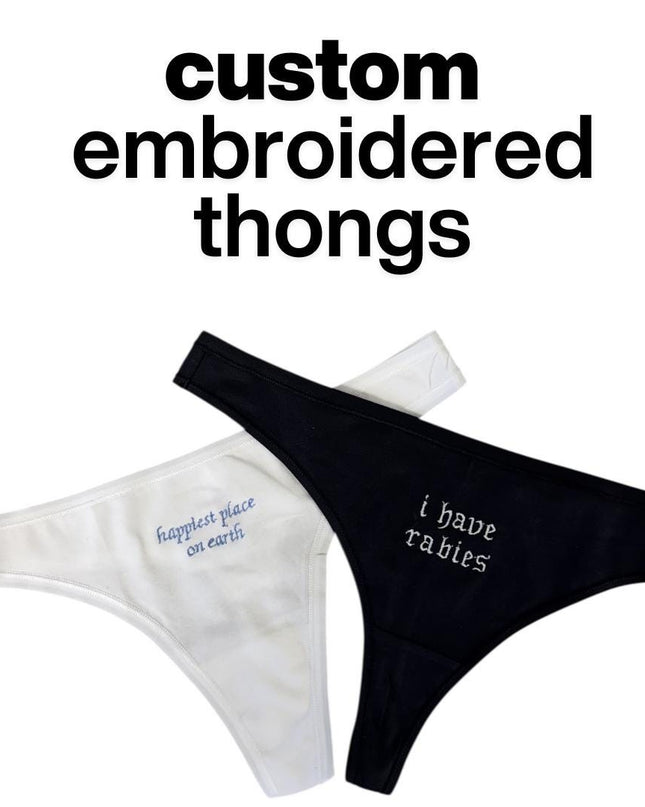 a pair of custom embroidered thongs, with one being white and the other black. The text above the thongs reads "custom embroidered thongs".